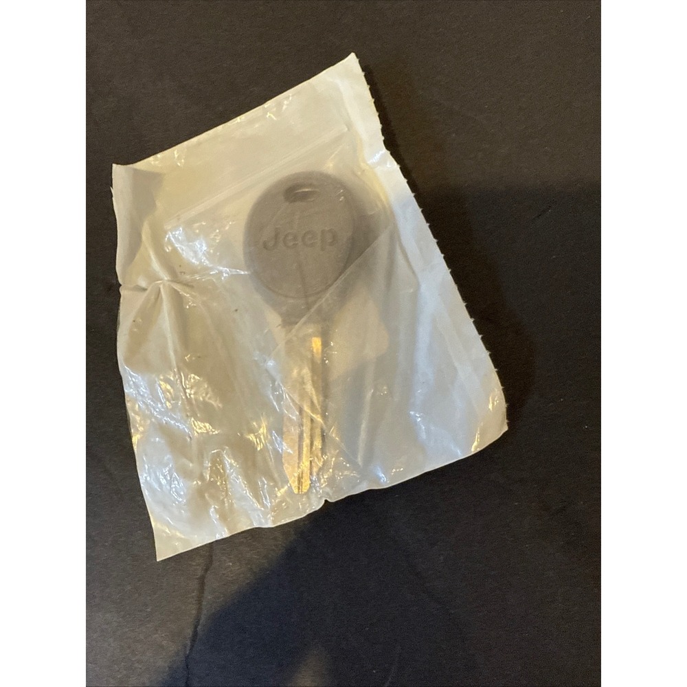 Jeep OEM Transponder Key Blank 5143553AA Wrangler Grand Cherokee Liberty Logo